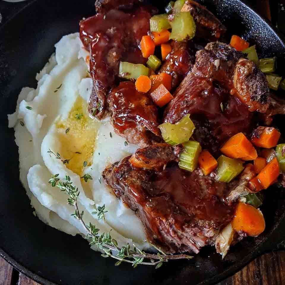 Cherry cola braised short ribs served with mashed potatoes.